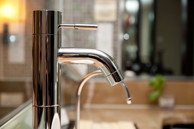 Leaking tap being repaired in Thames Ditton